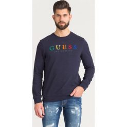 BLUZA JED Guess. Niebieskie bluzy męskie Guess, l, z aplikacjami, z bawełny, bez ramiączek, bez kaptura. Za 221.40 zł.