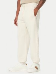 Guess Spodnie dresowe Z6BB03 K6544 Kremowy Regular Fit. Białe spodnie sportowe męskie Guess, m, z aplikacjami, z dresówki. Za 434.99 zł.