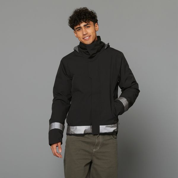 Ciepła kurtka przeciwdeszczowa na rower miejski męska Btwin 540 odblaskowa. Brązowe kurtki męskie B'TWIN, m, bez wzorów, z tworzywa sztucznego, sportowe, bez kaptura. Za 419.99 zł.