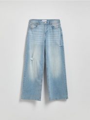 Jeansy wide leg z przetarciami - niebieski. Niebieskie jeansy damskie Reserved, bez wzorów, z bawełny. W wyprzedaży za 69.99 zł.