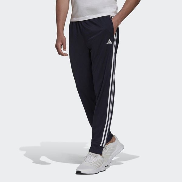 Primegreen Essentials Warm-Up Tapered 3-Stripes Track Pants. Białe spodnie sportowe męskie Adidas, xs, bez wzorów, z dresówki, na fitness i siłownię. W wyprzedaży za 157.05 zł.