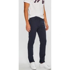 Jack & Jones - Spodnie. Niebieskie spodnie materiałowe męskie Jack & Jones, bez wzorów, z bawełny. W wyprzedaży za 89.90 zł.