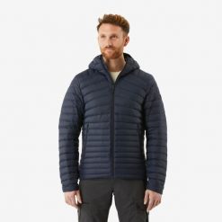 Kurtka puchowa turystyczna męska Forclaz MT100 -5°C. Niebieskie kurtki męskie FORCLAZ, l, bez wzorów, z materiału, sportowe, z kapturem. Za 299.99 zł.