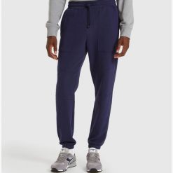 Spodnie dresowe męskie DIADORA PANTS CUFF SHIELD. Niebieskie spodnie sportowe męskie Diadora, m, bez wzorów, z dresówki, trekkingowe. Za 89.99 zł.