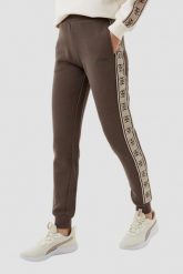 GUESS Brązowe damskie spodnie dresowe Britney Jogger. Brązowe spodnie dresowe damskie Guess, z aplikacjami, z bawełny, długie. W wyprzedaży za 322.99 zł.