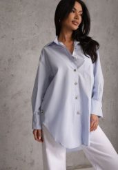 Niebieska Oversizowa Koszula z Bawełny z Eleganckimi Guzikami Rhenenore. Niebieskie koszule damskie Renee, l, bez wzorów, z bawełny, casualowe, bez kołnierzyka, bez ramiączek. Za 169.99 zł.