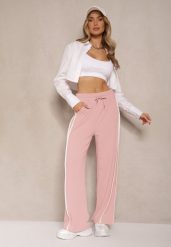 Różowe Szerokie Spodnie Dresowe High Waist Zdobione Lampasami Sopaline. Czerwone spodnie dresowe damskie Renee, z aplikacjami, z dresówki, eleganckie. Za 49.99 zł.