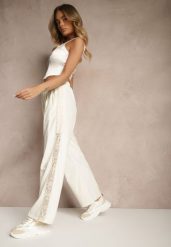 Jasnobeżowe Szerokie Spodnie z Bawełną High Waist Ozdobione Koronką Efandiela. Brązowe spodnie materiałowe damskie Renee, bez wzorów, z bawełny, eleganckie, z podwyższonym stanem, długie. Za 49.99 zł.