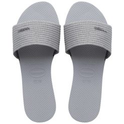 Klapki Havaianas Model 4147312 Kolor Szary. Szare klapki damskie Havaianas, bez wzorów, sportowe, bez obcasa, bez zapięcia. Za 179.99 zł.