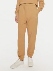 Tommy Hilfiger Spodnie dresowe WW0WW42883 Beżowy Regular Fit. Brązowe spodnie dresowe damskie Tommy Hilfiger, bez wzorów, z bawełny. Za 419.99 zł.