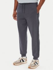 Guess Spodnie dresowe Z6YB13 K4965 Niebieski Regular Fit. Niebieskie spodnie materiałowe męskie Guess, z aplikacjami, z bawełny. Za 394.99 zł.