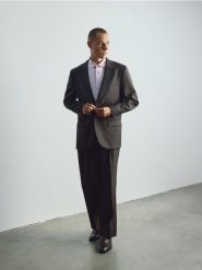 Wełniana marynarka slim fit - brązowy. Brązowe garnitury męskie Reserved, l, bez wzorów, z wełny, bez kołnierzyka, bez ramiączek. Za 599.99 zł.