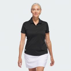 Koszulka polo Women's Solid Performance Short Sleeve. Czarne bluzki damskie Adidas, s, bez wzorów, z materiału, klasyczne, bez kołnierzyka, bez ramiączek. Za 229.00 zł.
