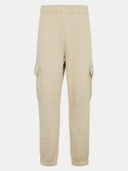 Champion Spodnie dresowe 117554 Beżowy Loose Fit. Brązowe spodnie dresowe damskie Champion, bez wzorów, z dresówki. Za 129.99 zł.