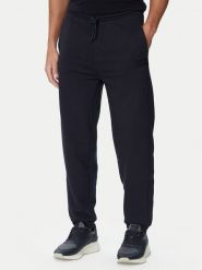 BOSS Spodnie dresowe Jt_Long Pants 50564096 Granatowy Relaxed Fit. Niebieskie spodnie sportowe męskie Boss, m, bez wzorów, z bawełny. Za 599.99 zł.