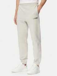 Calvin Klein Spodnie dresowe LV04LG212G Beżowy Regular Fit. Brązowe spodnie sportowe męskie Calvin Klein, l, bez wzorów, z bawełny. Za 329.99 zł.