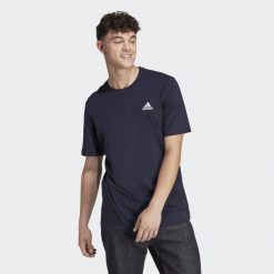 Koszulka sportowa męska adidas Essentials. Niebieskie koszulki sportowe męskie Adidas, m, bez wzorów, bez ramiączek, do piłki nożnej. Za 96.00 zł.