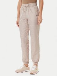 Guess Spodnie dresowe V5YB14 WHFU0 Beżowy Regular Fit. Brązowe spodnie dresowe damskie Guess, z aplikacjami, z dresówki. Za 304.00 zł.