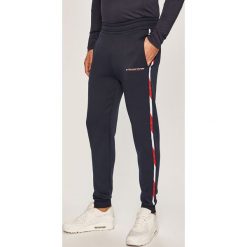 Tommy Sport - Spodnie. Niebieskie spodnie materiałowe męskie Tommy Sport, bez wzorów, z dzianiny. Za 389.90 zł.