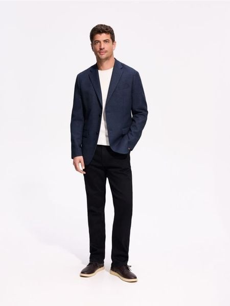 Marynarka regular fit - granatowy. Niebieskie garnitury męskie Reserved, l, bez wzorów, z tkaniny, bez kołnierzyka, bez ramiączek. Za 359.99 zł.