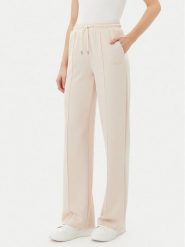 Guess Spodnie dresowe V5RB19 KCOB2 Beżowy Regular Fit. Brązowe spodnie dresowe damskie Guess, z aplikacjami, z dresówki. Za 209.99 zł.
