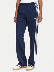 Adidas Spodnie dresowe Firebird Classic KS4795 Granatowy Regular Fit. Niebieskie spodnie dresowe damskie Adidas, bez wzorów, z dresówki. Za 299.99 zł.