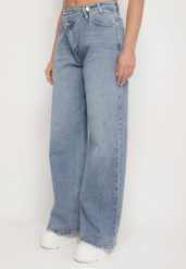 Niebieskie Casualowe Jeansy o Szerokim Kroju Tensurea. Niebieskie jeansy damskie Born2be, bez wzorów, z bawełny, sportowe. Za 119.99 zł.