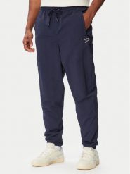 Reebok Spodnie dresowe Mieszko RK25722CCM Granatowy Regular Fit. Niebieskie spodnie sportowe męskie Reebok, m, bez wzorów, z dresówki. Za 299.99 zł.