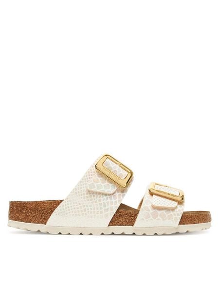 Birkenstock Klapki Sydney Cushion Buckle 1030258 Écru. Klapki damskie Birkenstock, bez wzorów, ze skóry, bez obcasa, bez zapięcia. Za 429.99 zł.