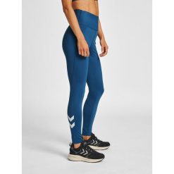 Damskie wysokie legginsy Hummel MT Grace. Niebieskie legginsy damskie Hummel, bez wzorów, z materiału. W wyprzedaży za 226.50 zł.