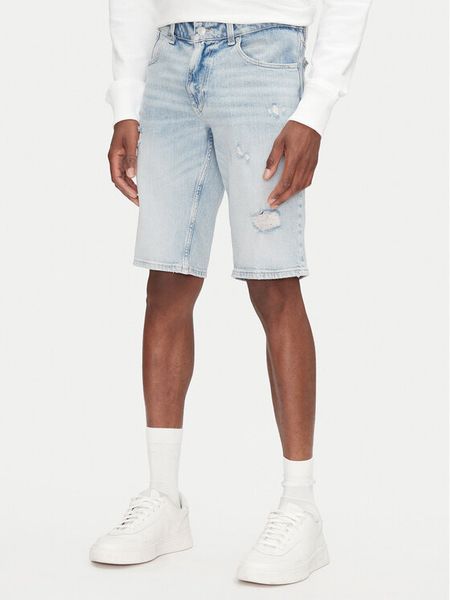 Tommy Jeans Szorty jeansowe Ronnie DM0DM21300 Niebieski Regular Fit. Niebieskie szorty męskie Tommy Jeans, bez wzorów, z bawełny. Za 229.99 zł.