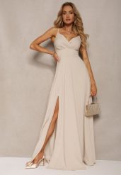 Beżowa Elegancka Sukienka o Rozkloszowanym Kroju z Rozcięciem na Ramiączkach z Kopertowym Dekoltem Winelia. Brązowe sukienki damskie Renee, na imprezę, l, bez wzorów, eleganckie, bez kołnierzyka, dla wysokich, bez ramiączek, maxi, kopertowe. Za 149.99 zł.