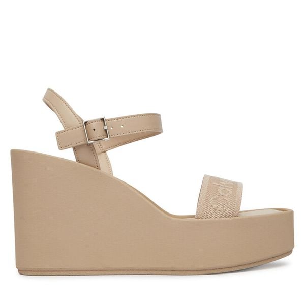 Sandały Calvin Klein. Brązowe sandały damskie Calvin Klein, bez wzorów, bez obcasa, na koturnie, bez zapięcia. Za 304.99 zł.