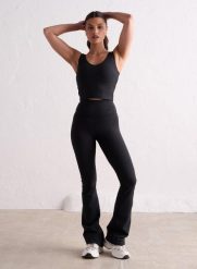 Damskie legginsy rozszerzane nogawki, wysoki stan, squat proof Sense czarny. Czarne legginsy damskie Aim'n, bez wzorów, z elastanu. Za 339.00 zł.