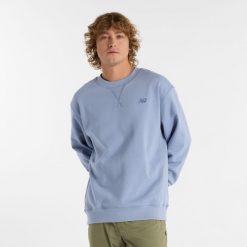 Bluza męska New Balance MT41506DUS – niebieska. Niebieskie bluzy męskie New Balance, m, z aplikacjami, z bawełny, klasyczne, bez ramiączek, bez kaptura. Za 249.99 zł.