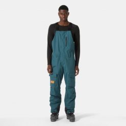 Spodnie narciarskie z szelkami i kieszenią cargo Helly Hansen Sogn. Zielone spodnie sportowe męskie Helly Hansen, m, bez wzorów, narciarskie. Za 1,037.00 zł.