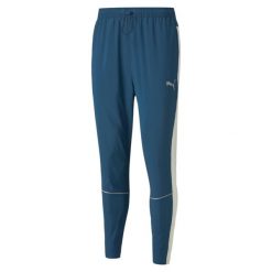 Puma Spodnie Run Tapered 52085865. Niebieskie spodnie sportowe męskie Puma, m, bez wzorów, z dresówki. W wyprzedaży za 233.95 zł.