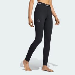 LEGGINSY BAZOWE TERREX MULTI SYNTHETIC. Czarne legginsy damskie Adidas, bez wzorów, z dzianiny. Za 219.00 zł.