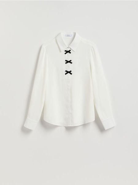 Koszula z kokardkami - biały. Białe koszule damskie Reserved, l, bez wzorów, z tkaniny, bez kołnierzyka, bez ramiączek. Za 99.99 zł.