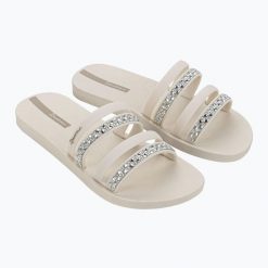 Klapki damskie Ipanema Chic Slide. Brązowe klapki damskie Ipanema, bez wzorów, bez obcasa, bez zapięcia. Za 99.99 zł.