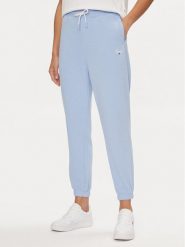 Tommy Jeans Spodnie dresowe Script DW0DW17771 Błękitny Relaxed Fit. Niebieskie spodnie dresowe damskie Tommy Jeans, bez wzorów, z dresówki. Za 469.99 zł.