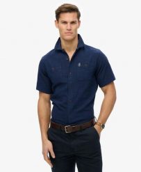 Superdry Koszula krótki rękaw The Merchant Store o fakturze. Niebieskie koszule damskie Superdry, l, bez wzorów, z bawełny, vintage, bez kołnierzyka, bez ramiączek. Za 344.20 zł.