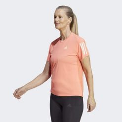Koszulka do biegania damska Adidas Own the Run Tee. Brązowe bluzki damskie Adidas, xs, bez wzorów, z materiału, sportowe, bez kołnierzyka, bez ramiączek. W wyprzedaży za 110.75 zł.