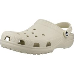 Klapki dla dorosłych Crocs Classic. Brązowe klapki damskie Crocs, bez wzorów, z materiału, sportowe, bez obcasa, bez zapięcia. W wyprzedaży za 201.35 zł.