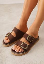 Brązowe Klapki VICES Ozdobione Dużymi Klamrami Jenniviane. Brązowe klapki damskie Renee, na lato, bez wzorów, z jeansu, eleganckie, bez obcasa, na płaskiej podeszwie, bez zapięcia. Za 99.99 zł.