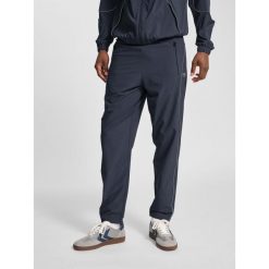 Spodnie dresowe tkane Hummel Pulse. Brązowe spodnie sportowe męskie Hummel, bez wzorów, z dresówki, na fitness i siłownię. Za 236.50 zł.