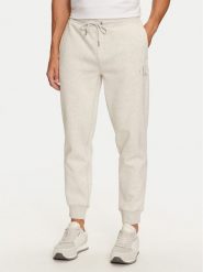 Calvin Klein Jeans Spodnie dresowe Monologo J30J325658 Szary Regular Fit. Szare spodnie sportowe męskie Calvin Klein Jeans, m, bez wzorów, z bawełny. Za 339.99 zł.