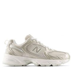 Damskie tenisówki New Balance. Żółte trampki i tenisówki damskie New Balance, bez wzorów, z materiału, bez zapięcia. Za 528.75 zł.