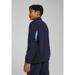 Młodzieżowa kurtka Manchester City ftblARCHIVE PUMA Navy Team Light Blue. Niebieskia kurtki męskie Puma, m, z aplikacjami, młodzieżowe, bez kaptura. W wyprzedaży za 219.00 zł.