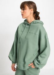Bluza z kapturem oversized, z miękkiego materiału z bawełną. Zielone bluzy damskie bonprix, bez wzorów, z bawełny, bez ramiączek, z kapturem. Za 99.99 zł.
